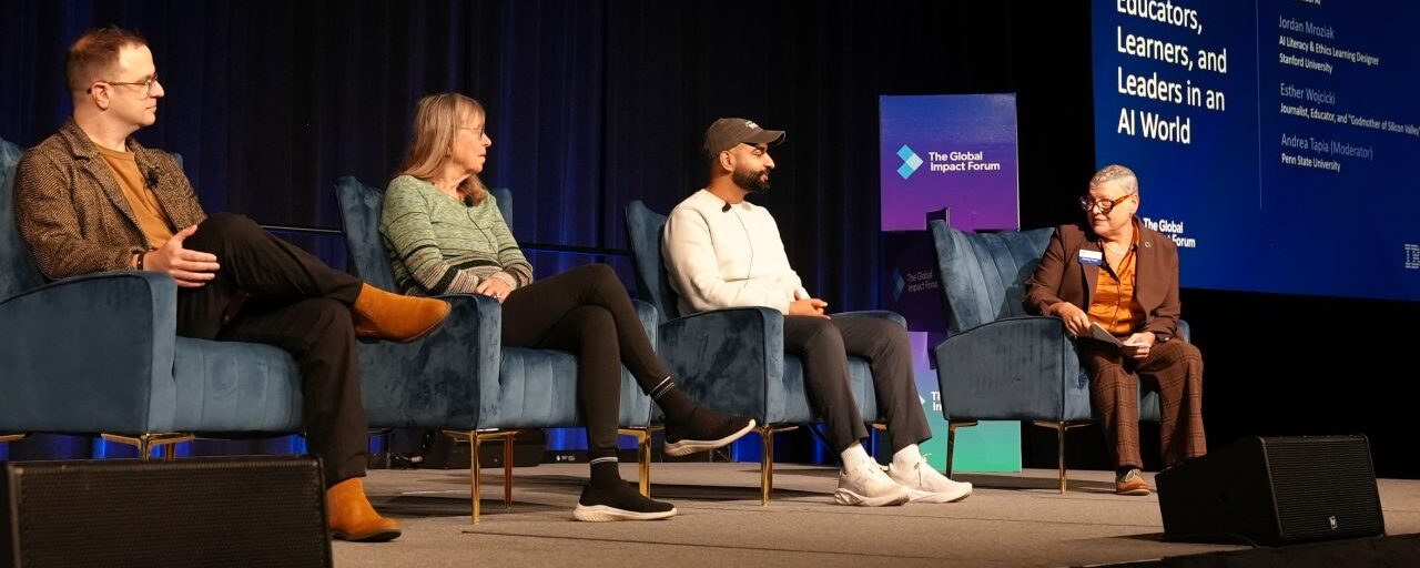 Participants sit on stage at the TGIF conference.